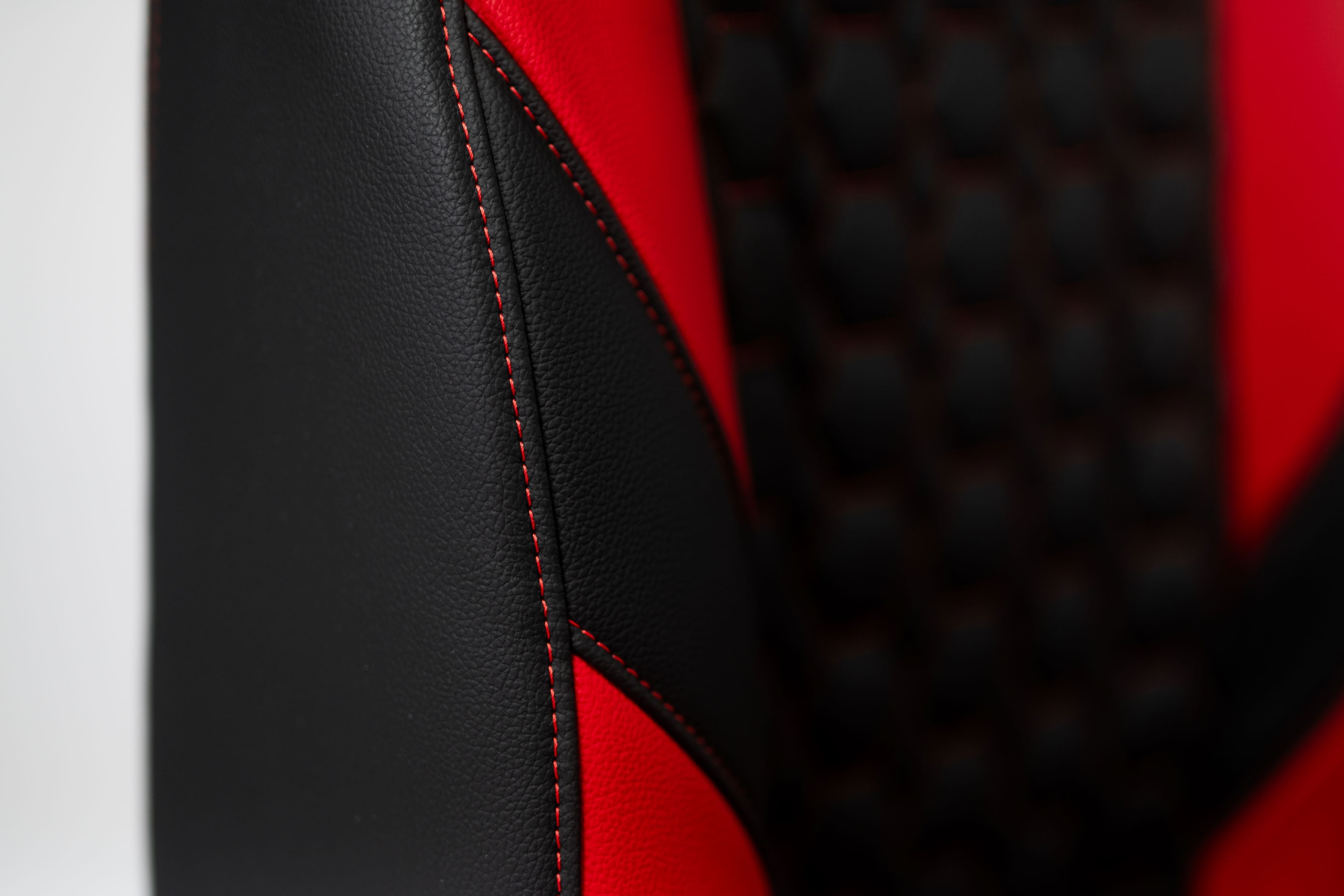 Kratos Pro 4D Throne V2 Vengeance showing side cushion and red switching in detail