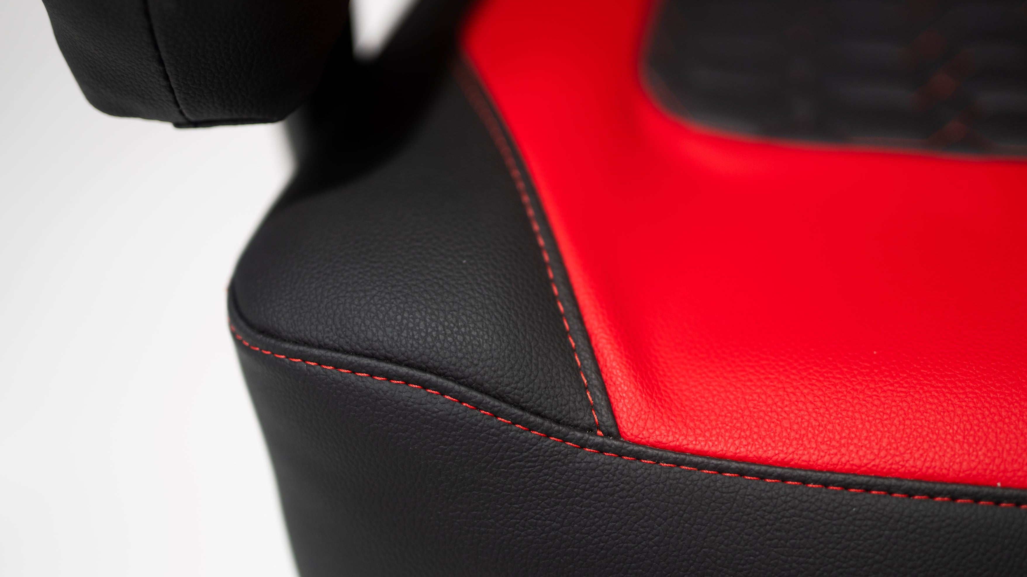 Kratos 4D Throne V2 Corner Cushion showing red stitching and black thermal leather