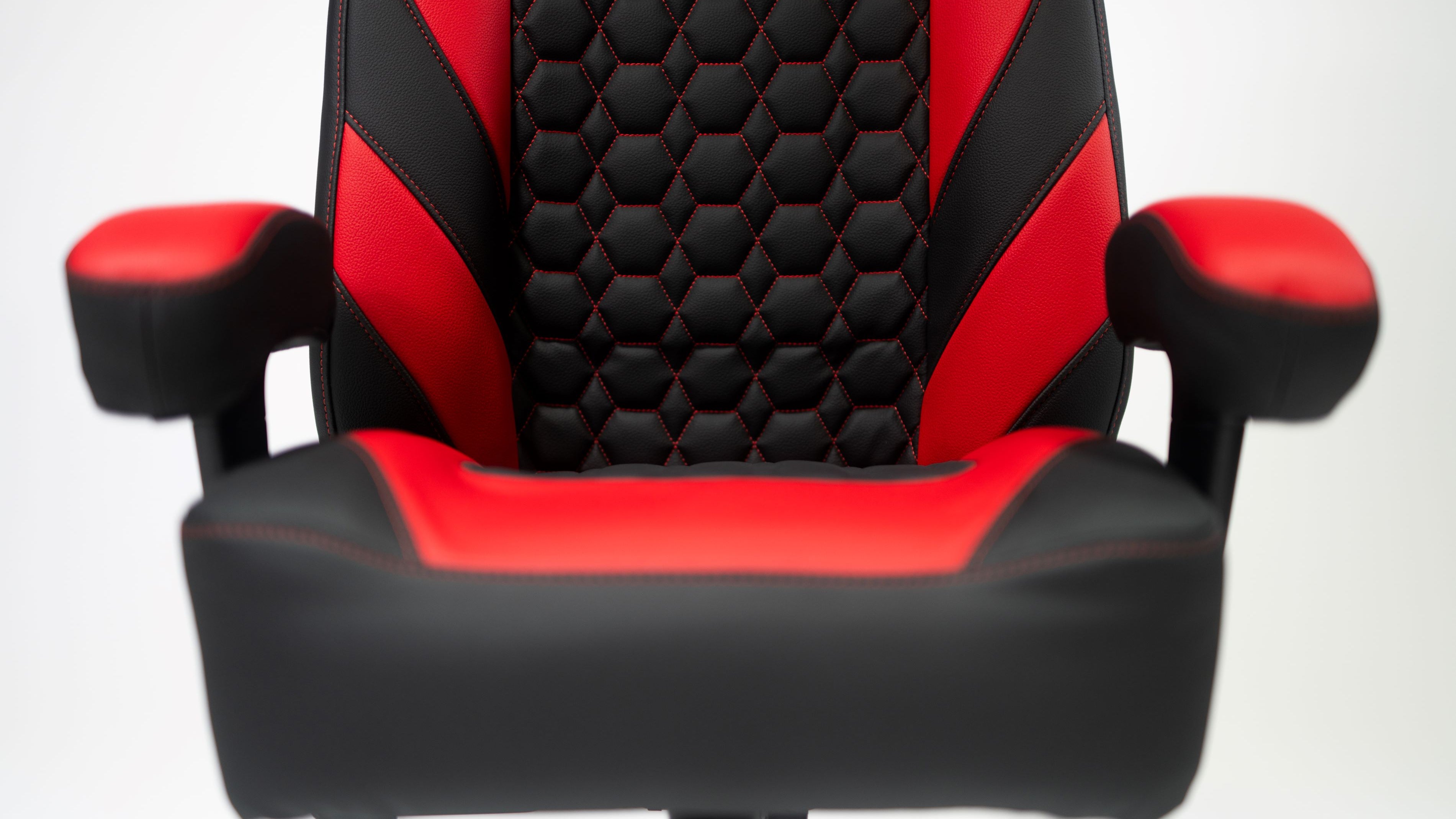 Center view of black and red haptic gaming chair Kratos Pro 4D Throne V2